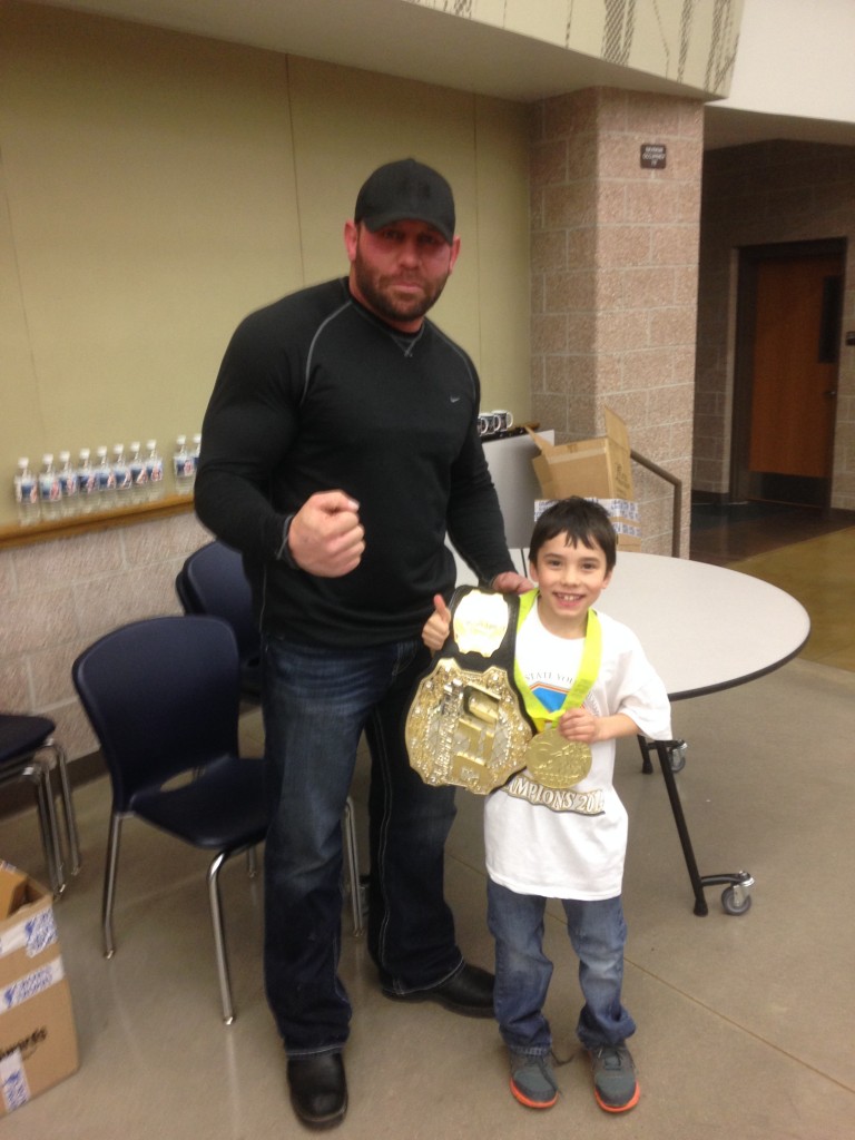 Satch and UFC Heavyweight Champion Shane Carwin at tonight's Frederick Warriors Wrestling Club Awards Banquet. Satchel is in the white.  And clean shaven.